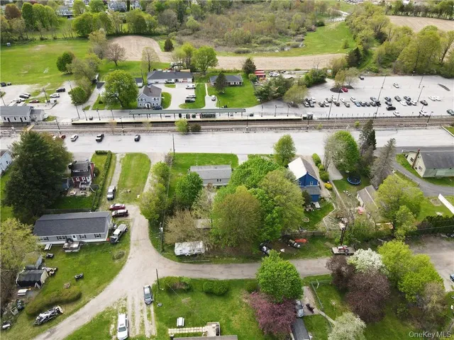 an aerial view of house with yard swimming pool and outdoor seating