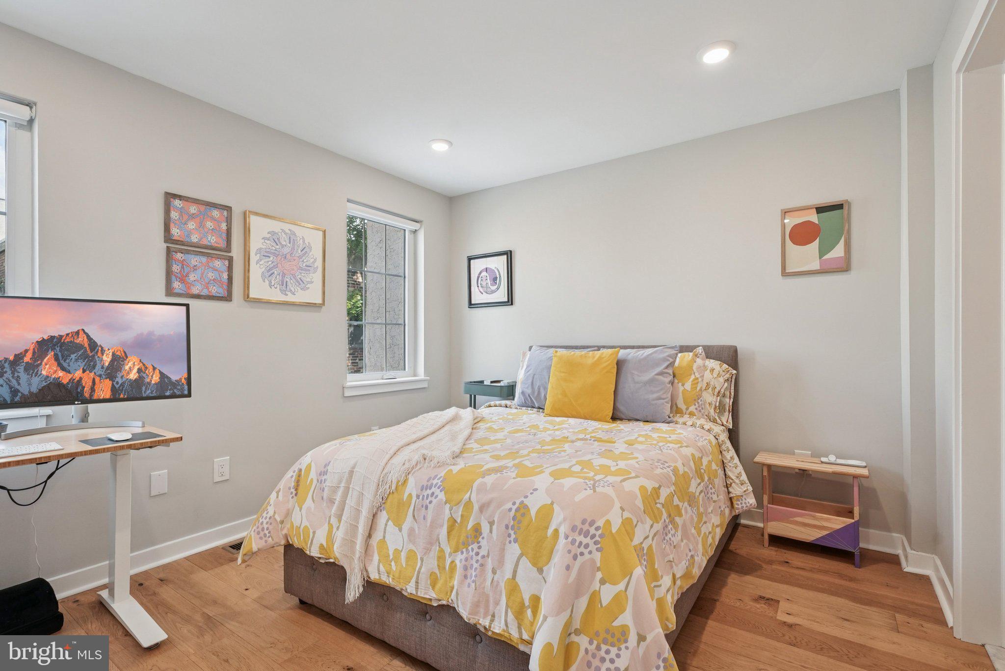 919 Reed Street Philadelphia, PA 19147 - Photo 12 of 28 a bedroom with a bed and a desk