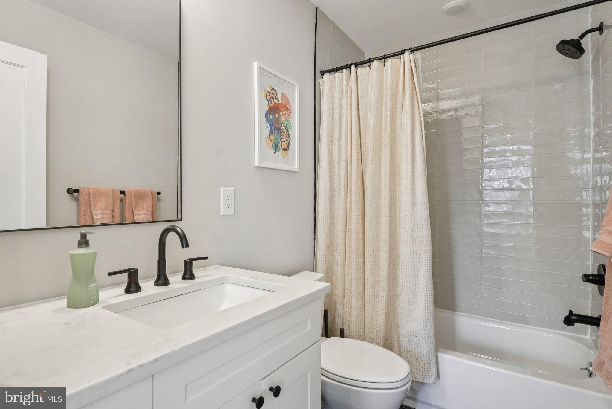 919 Reed Street Philadelphia, PA 19147 - Photo 14 of 28 a bathroom with a sink toilet and shower