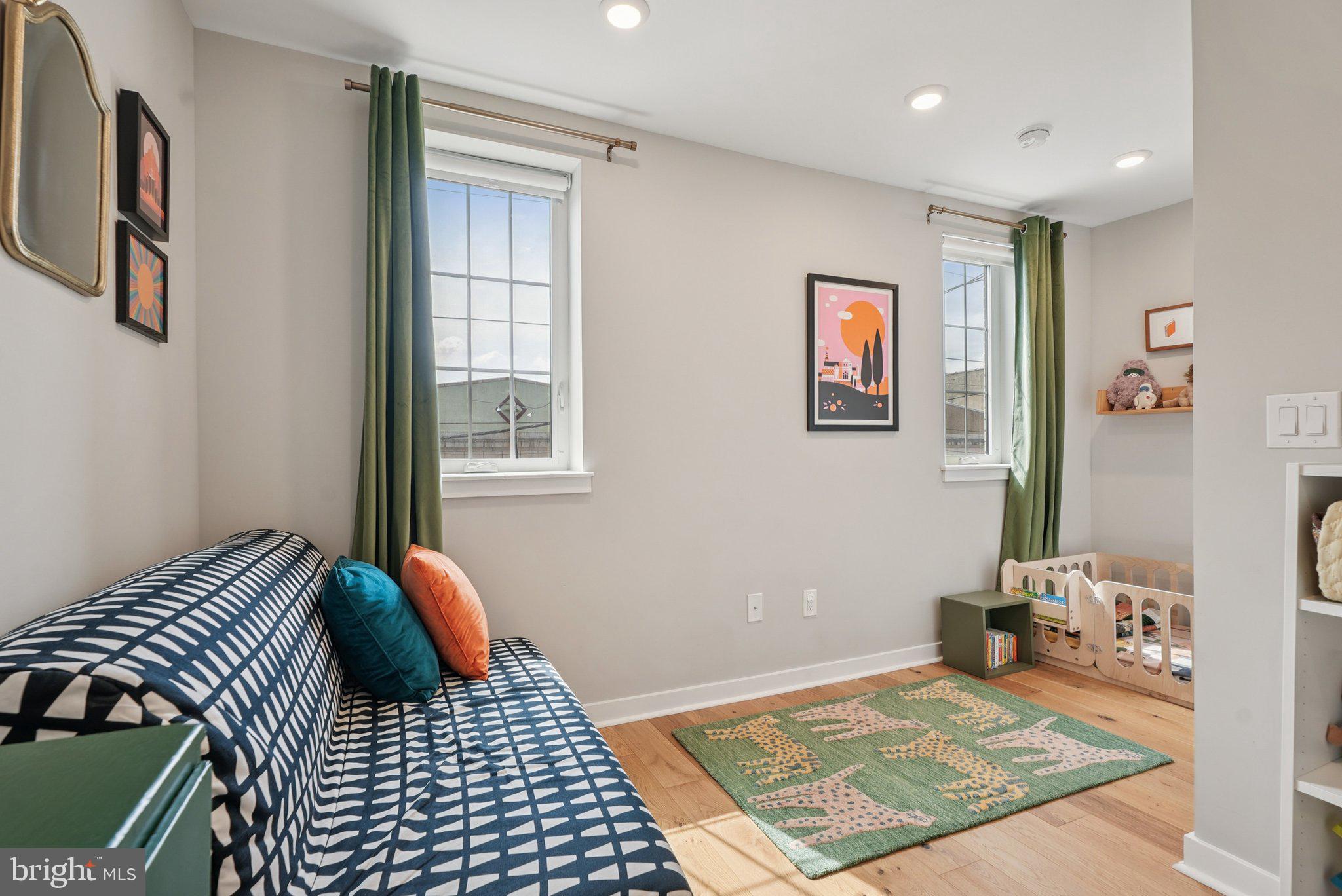 919 Reed Street Philadelphia, PA 19147 - Photo 15 of 28 a bedroom with a bed and wooden floor
