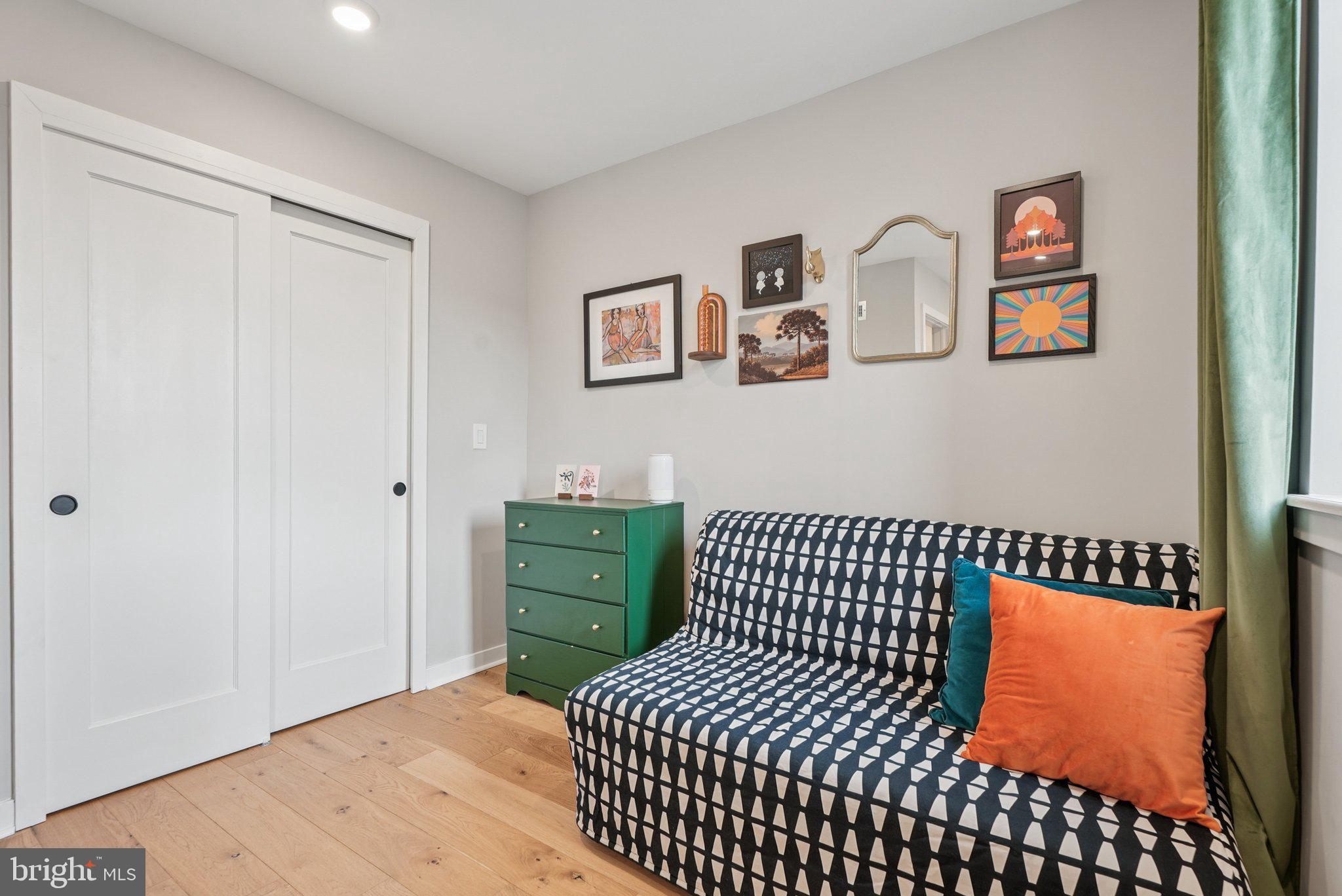 919 Reed Street Philadelphia, PA 19147 - Photo 16 of 28 a bedroom with a bed and cabinets
