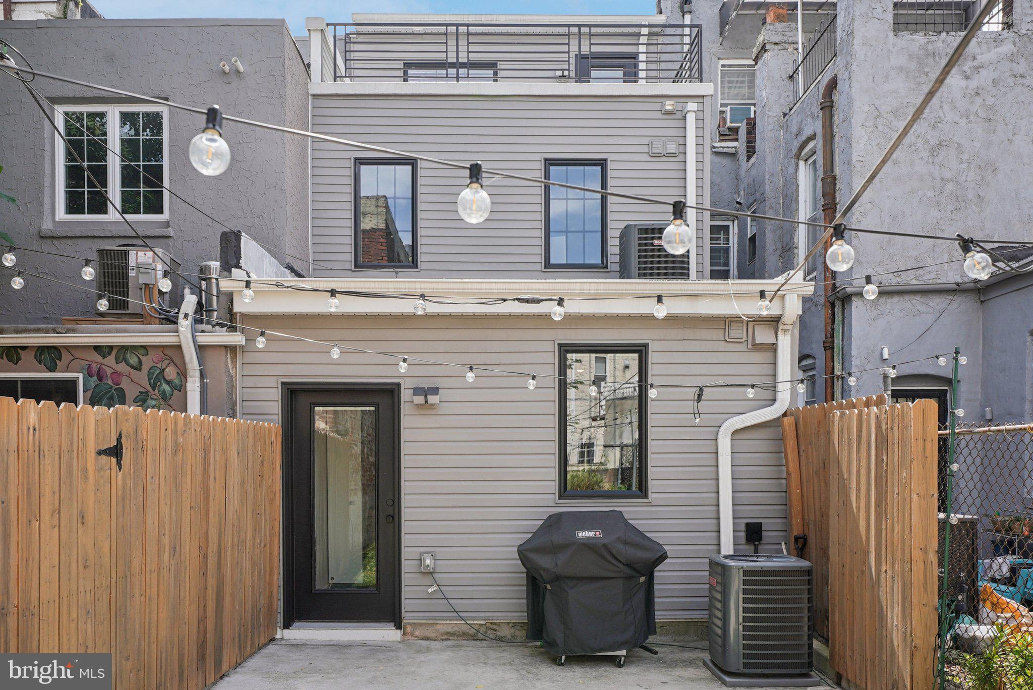 919 Reed Street Philadelphia, PA 19147 - Photo 26 of 28 a front view of a house with a garden