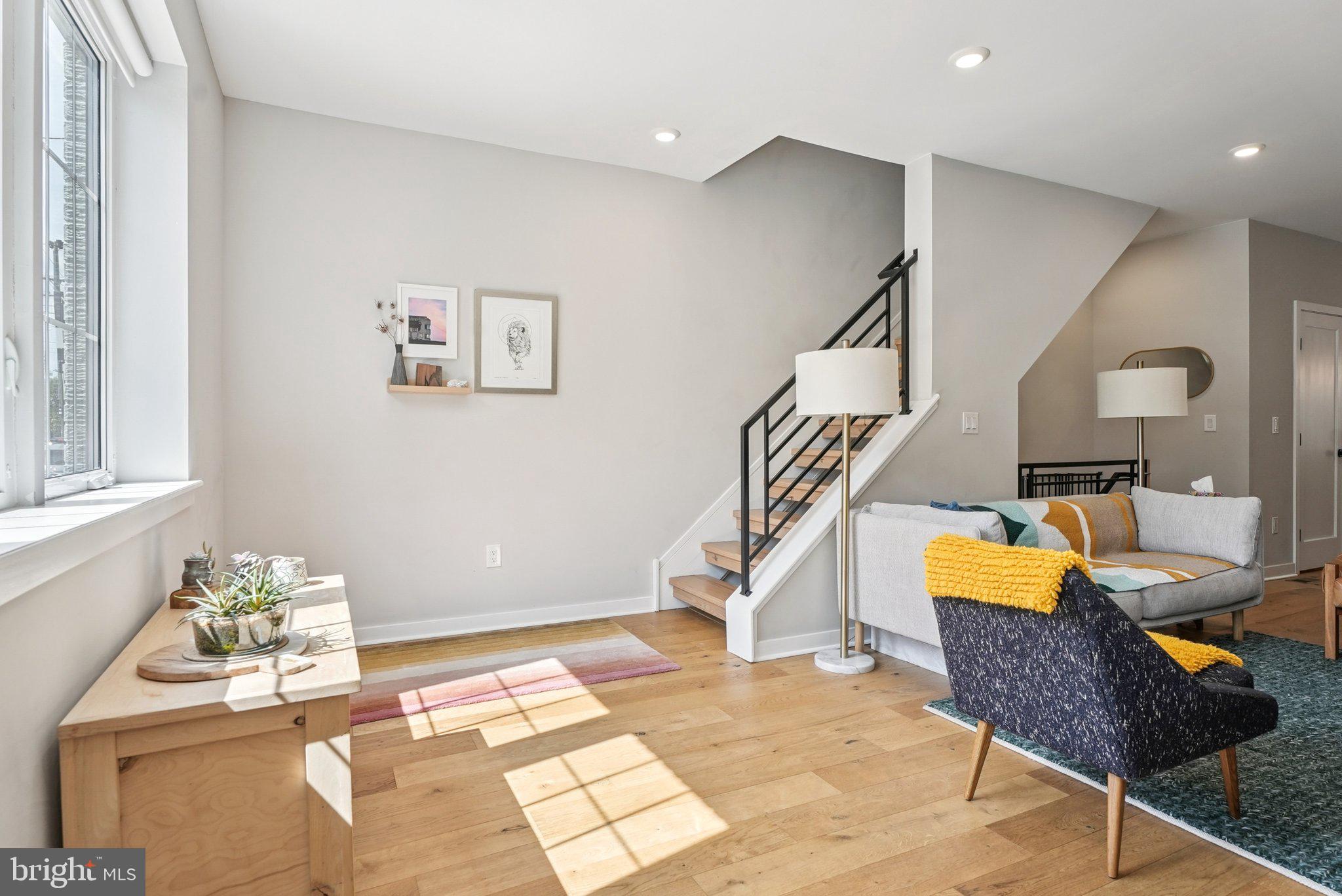 919 Reed Street Philadelphia, PA 19147 - Photo 3 of 28 a living room with furniture and stairs