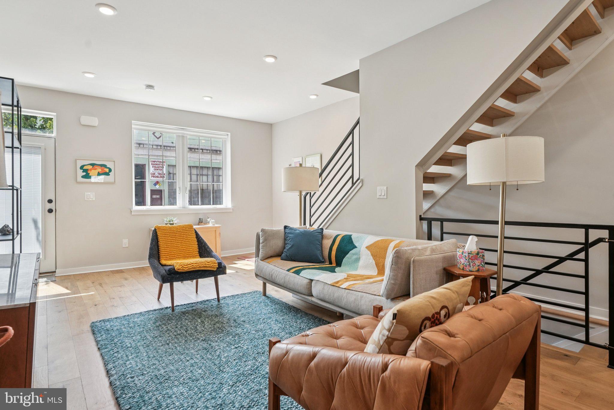 919 Reed Street Philadelphia, PA 19147 - Photo 5 of 28 a living room with furniture a rug and a lamp