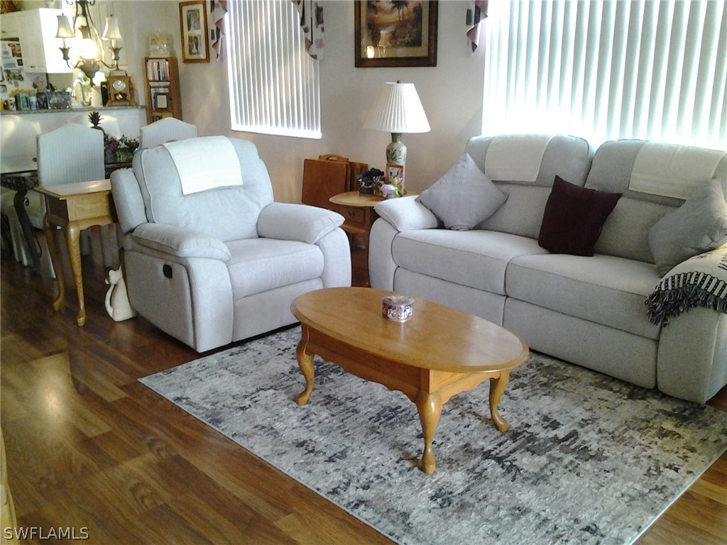 a living room with furniture and a rug