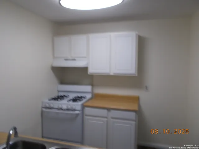 a bathroom with a sink and a window