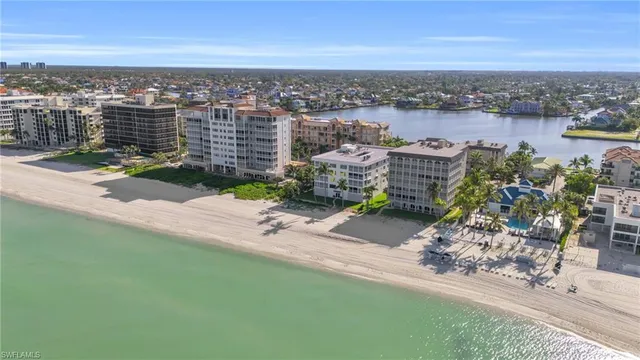 an aerial view of a house with a lake view