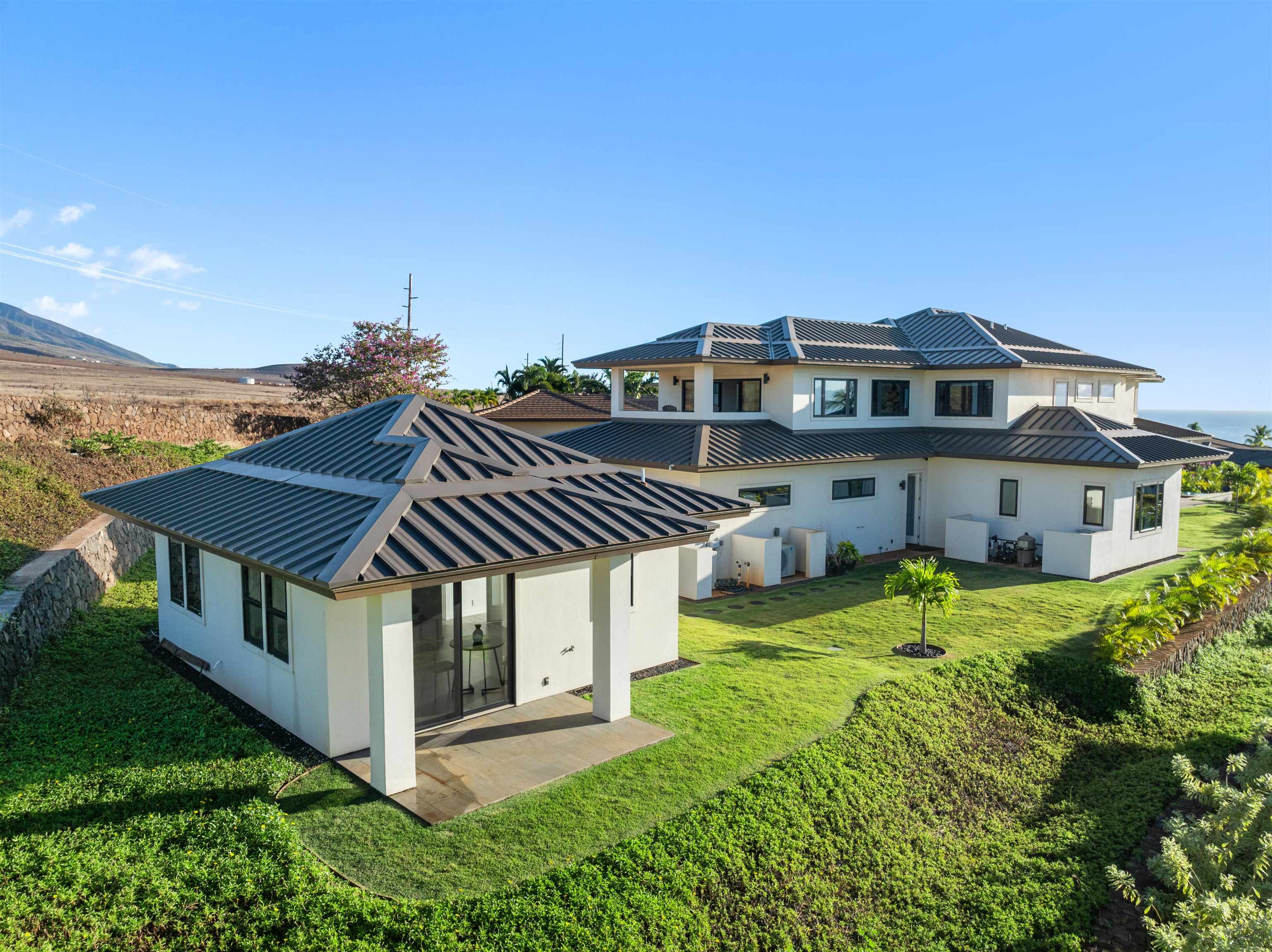 a front view of a house with a yard table and chairs