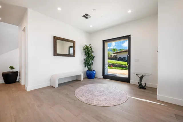 a view of a livingroom with furniture and a window