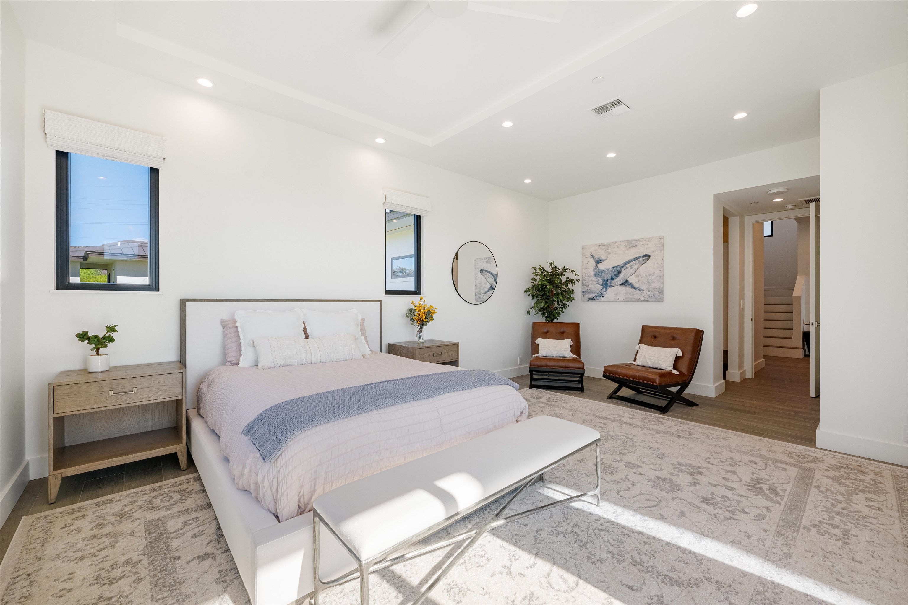 804 Anapuni Loop Lahaina, HI 96761 - Photo 25 of 49 a spacious bedroom with a bed a couch and a potted plant