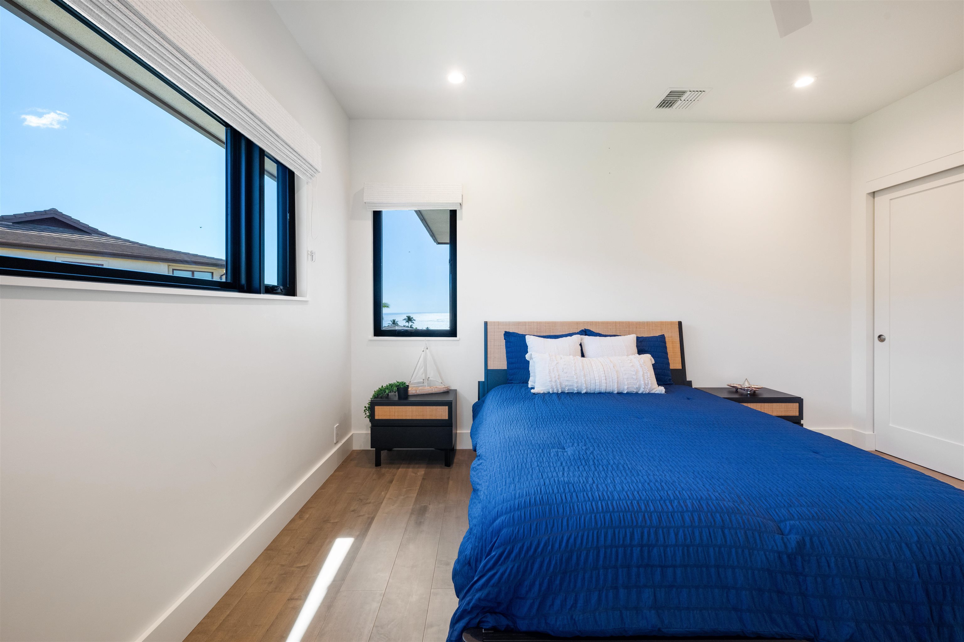 804 Anapuni Loop Lahaina, HI 96761 - Photo 38 of 49 a bedroom with a bed and a night stand