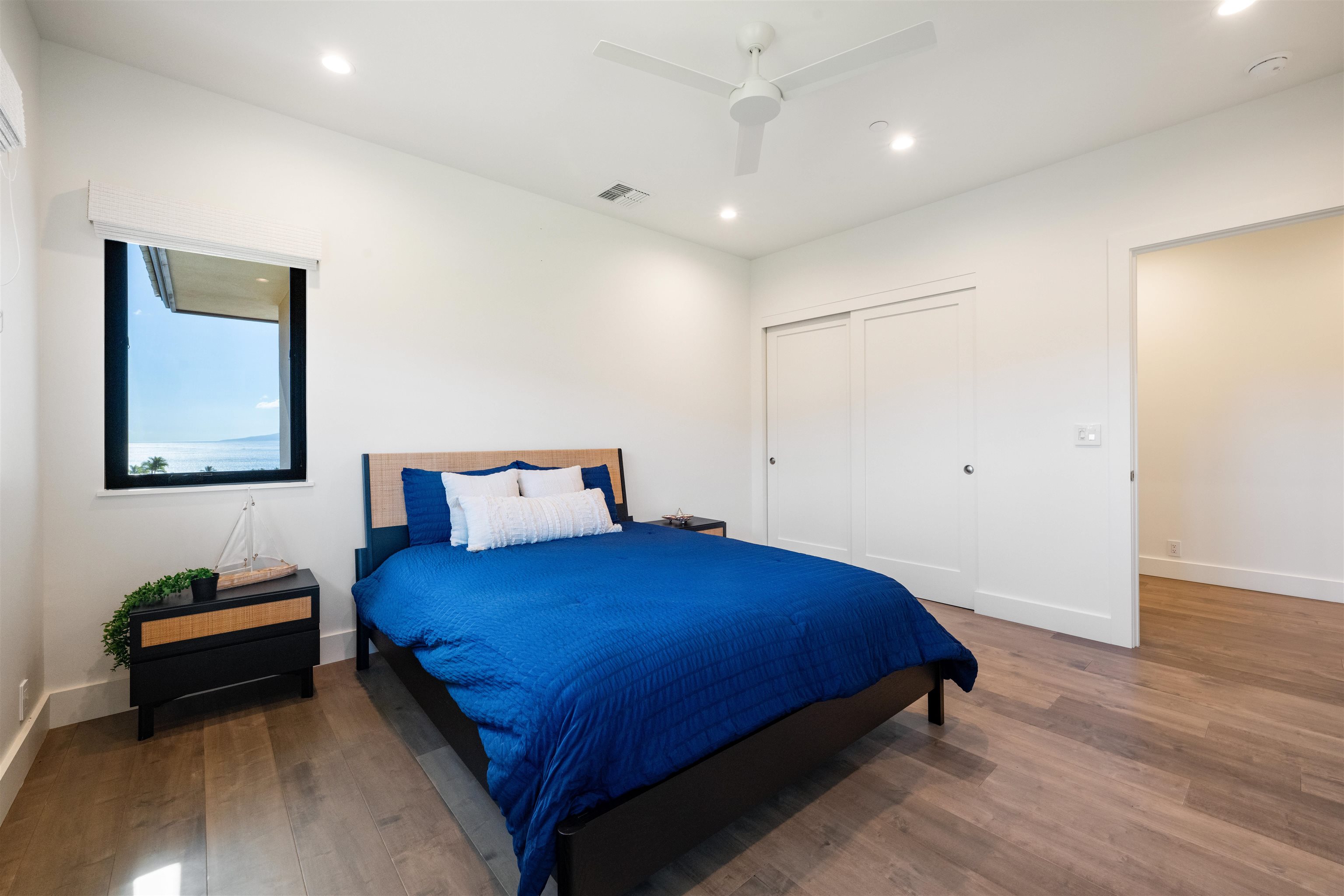 804 Anapuni Loop Lahaina, HI 96761 - Photo 39 of 49 a bedroom with a bed and a night stand