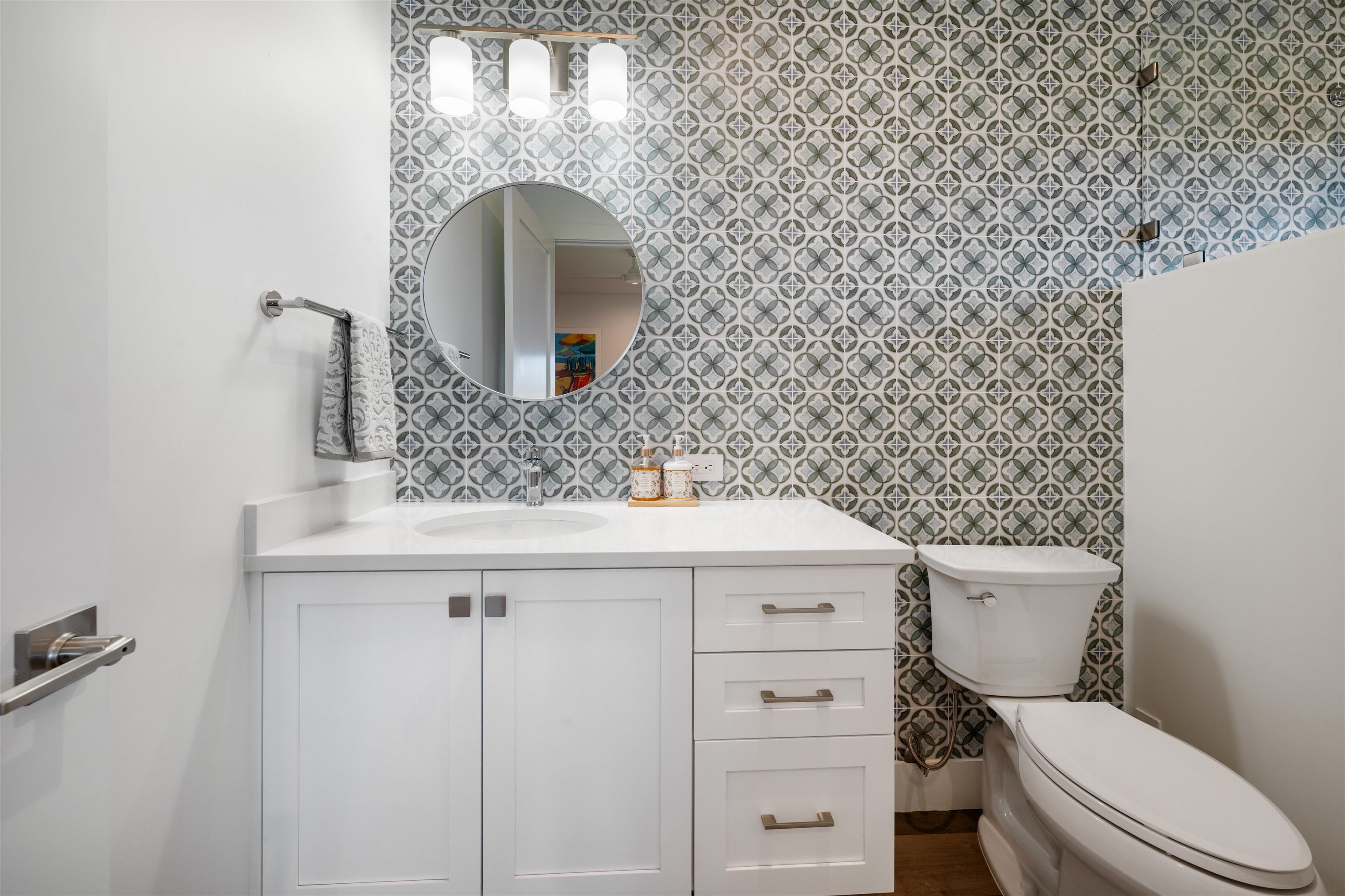 804 Anapuni Loop Lahaina, HI 96761 - Photo 40 of 49 a bathroom with a toilet sink and mirror