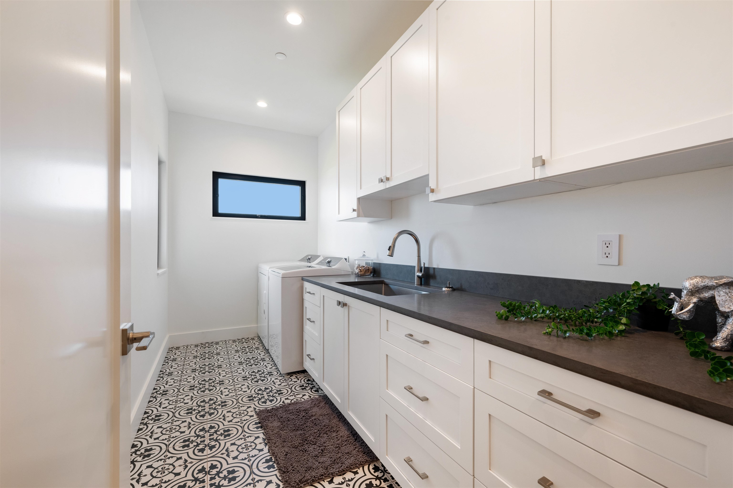 804 Anapuni Loop Lahaina, HI 96761 - Photo 41 of 49 a kitchen with granite countertop white cabinets and sink