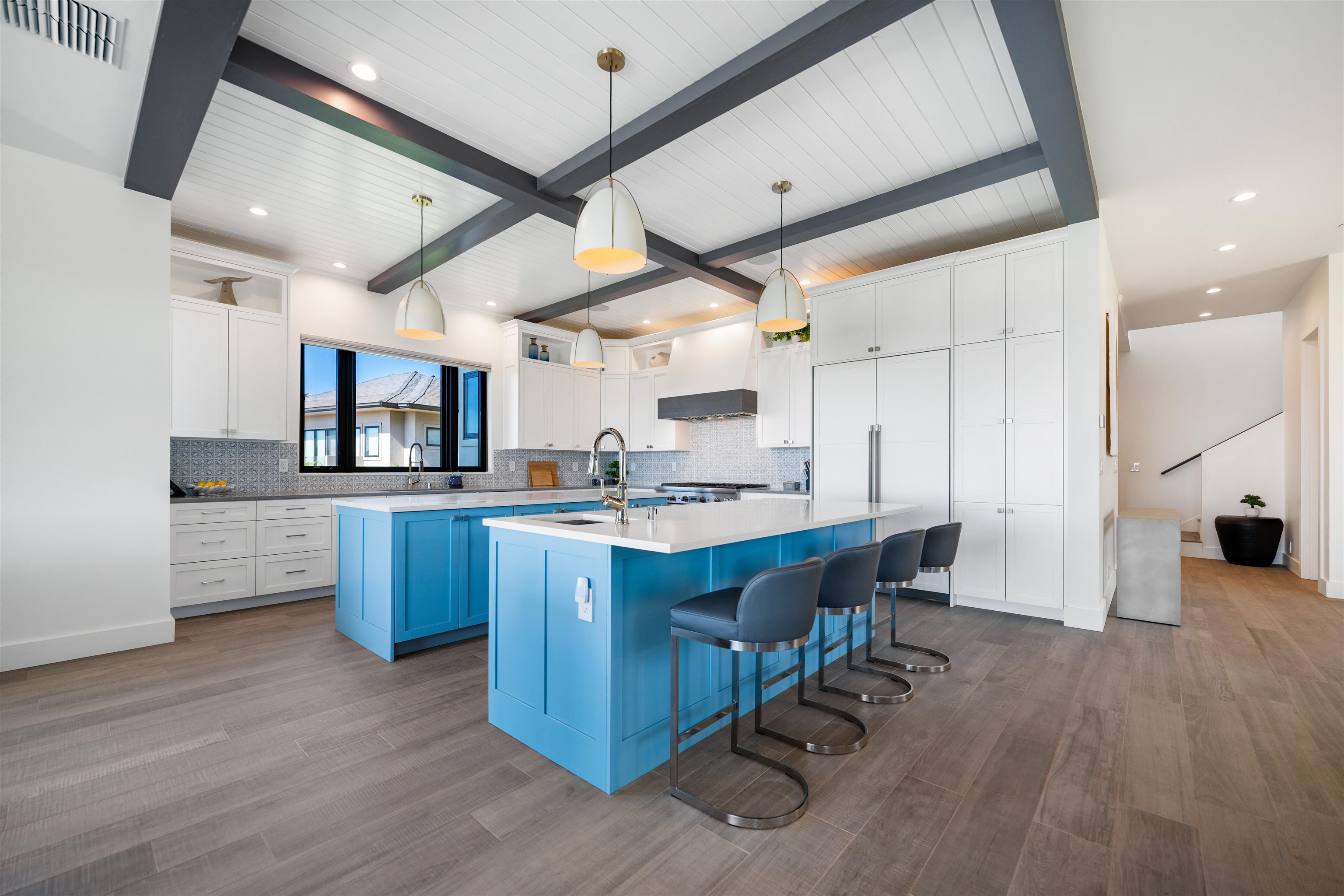804 Anapuni Loop Lahaina, HI 96761 - Photo 6 of 49 a kitchen with stainless steel appliances kitchen island granite countertop a table chairs sink and cabinets