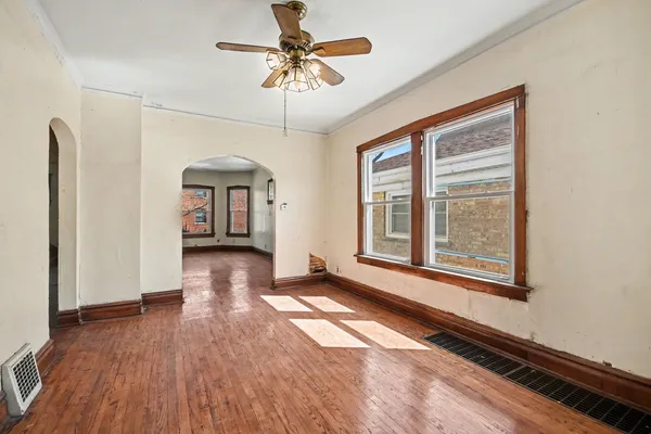 a view of livingroom with hardwood floor and a ceiling fan