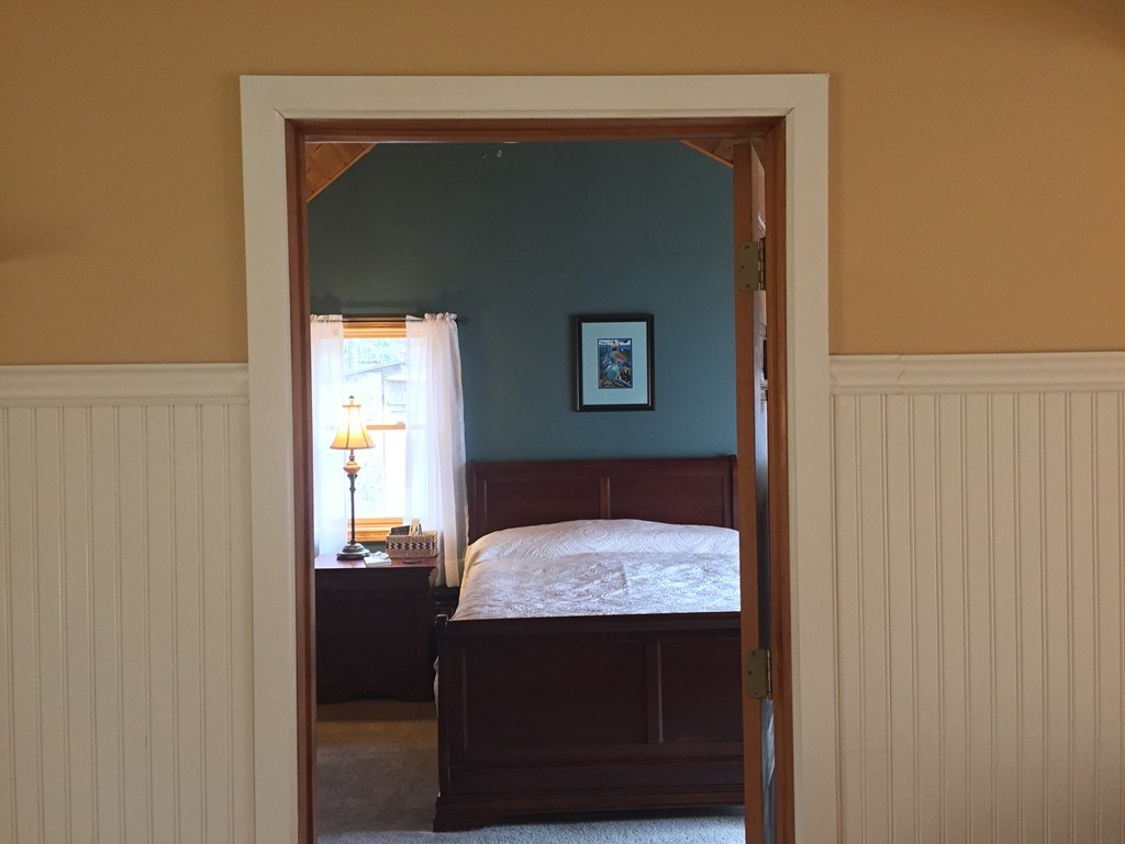 283 Main Road Chesterfield, MA 01012 - Photo 13 of 30 a room that has a bed and a table in it