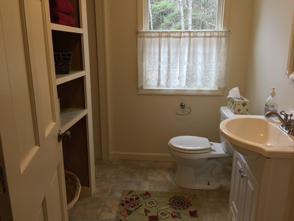 283 Main Road Chesterfield, MA 01012 - Photo 18 of 30 a bathroom with a sink a toilet and a window