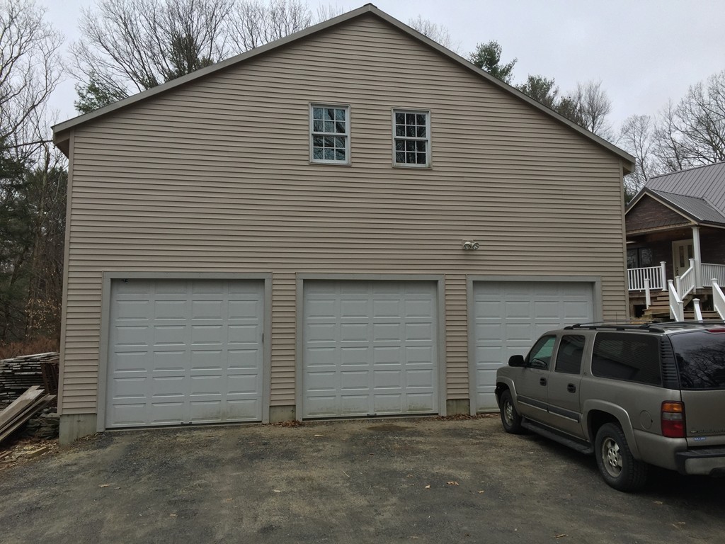 283 Main Road Chesterfield, MA 01012 - Photo 25 of 30 a front view of a house with garage