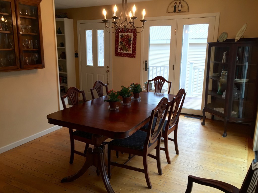 283 Main Road Chesterfield, MA 01012 - Photo 3 of 30 a view of a dining room with furniture and wooden floor