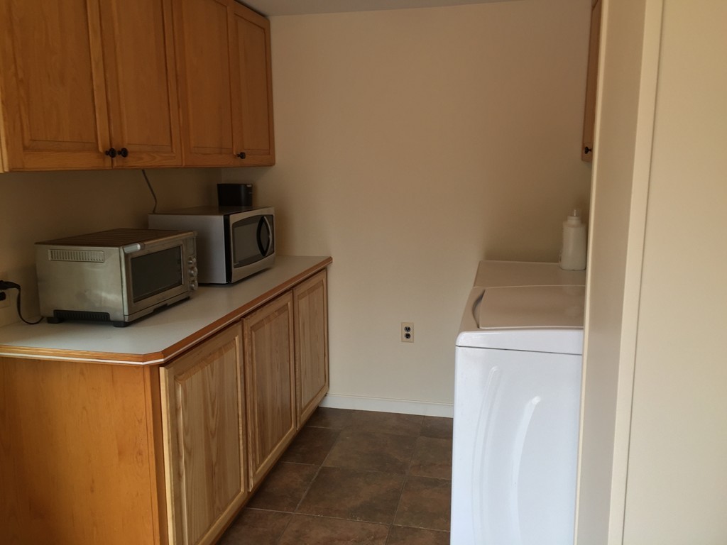 283 Main Road Chesterfield, MA 01012 - Photo 9 of 30 a kitchen with a refrigerator and cabinets