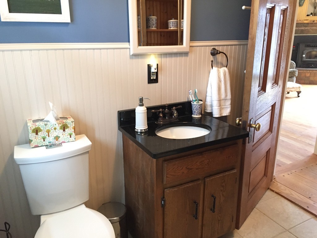 283 Main Road Chesterfield, MA 01012 - Photo 10 of 30 a bathroom with a sink toilet and a mirror