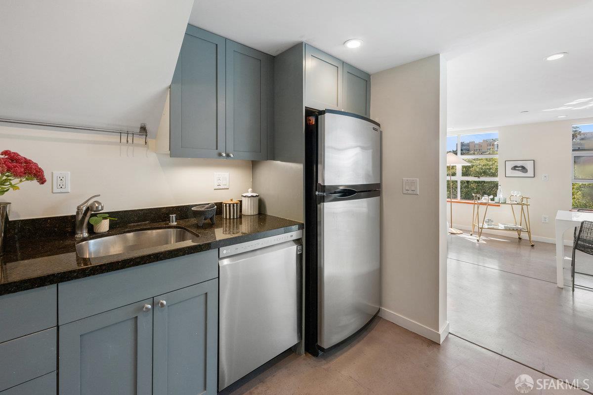 1325 Indiana Street, Unit 301 San Francisco, CA 94107 - Photo 17 of 41 a kitchen with granite countertop a refrigerator and a sink