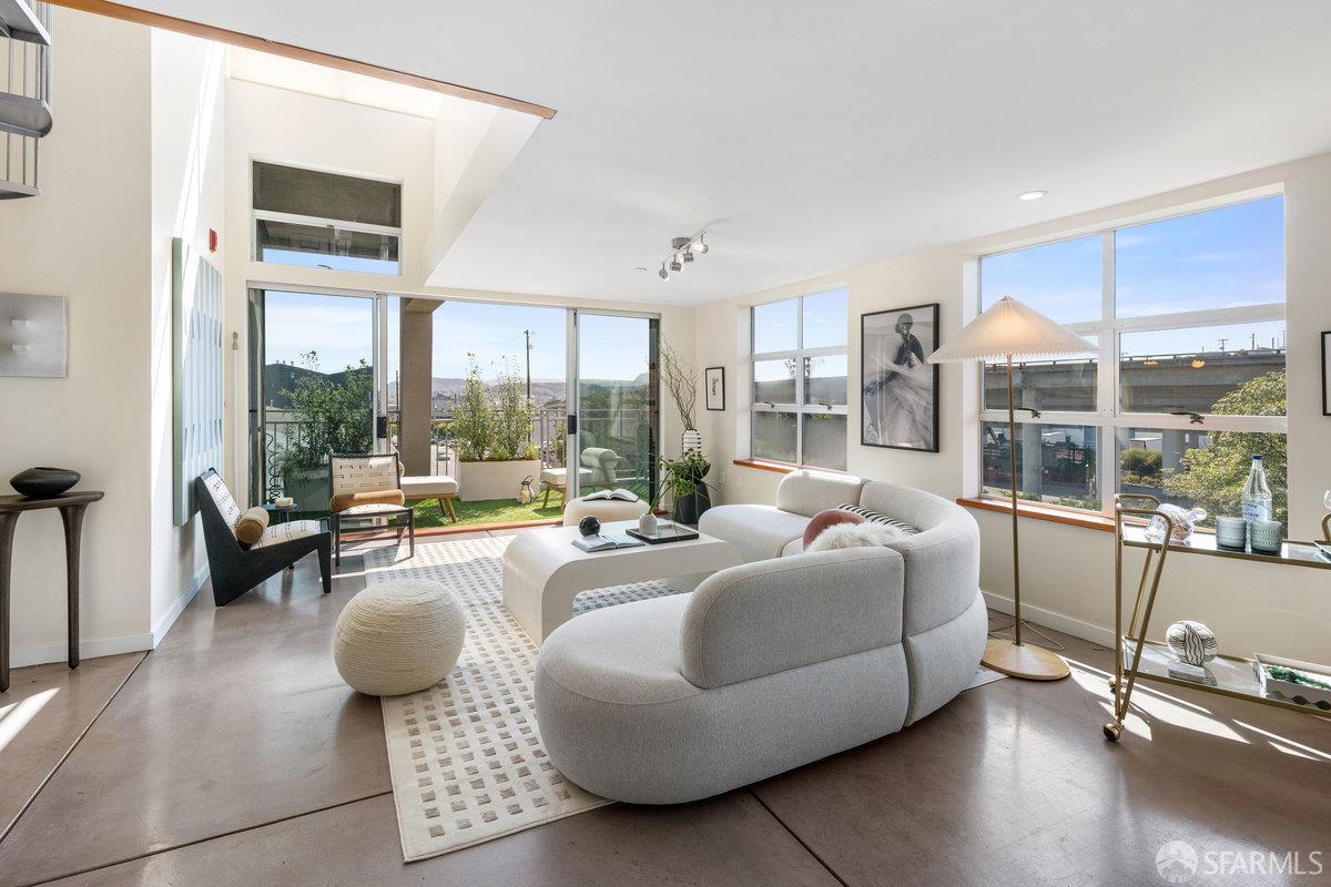 1325 Indiana Street, Unit 301 San Francisco, CA 94107 - Photo 2 of 41 a living room with furniture and a large window