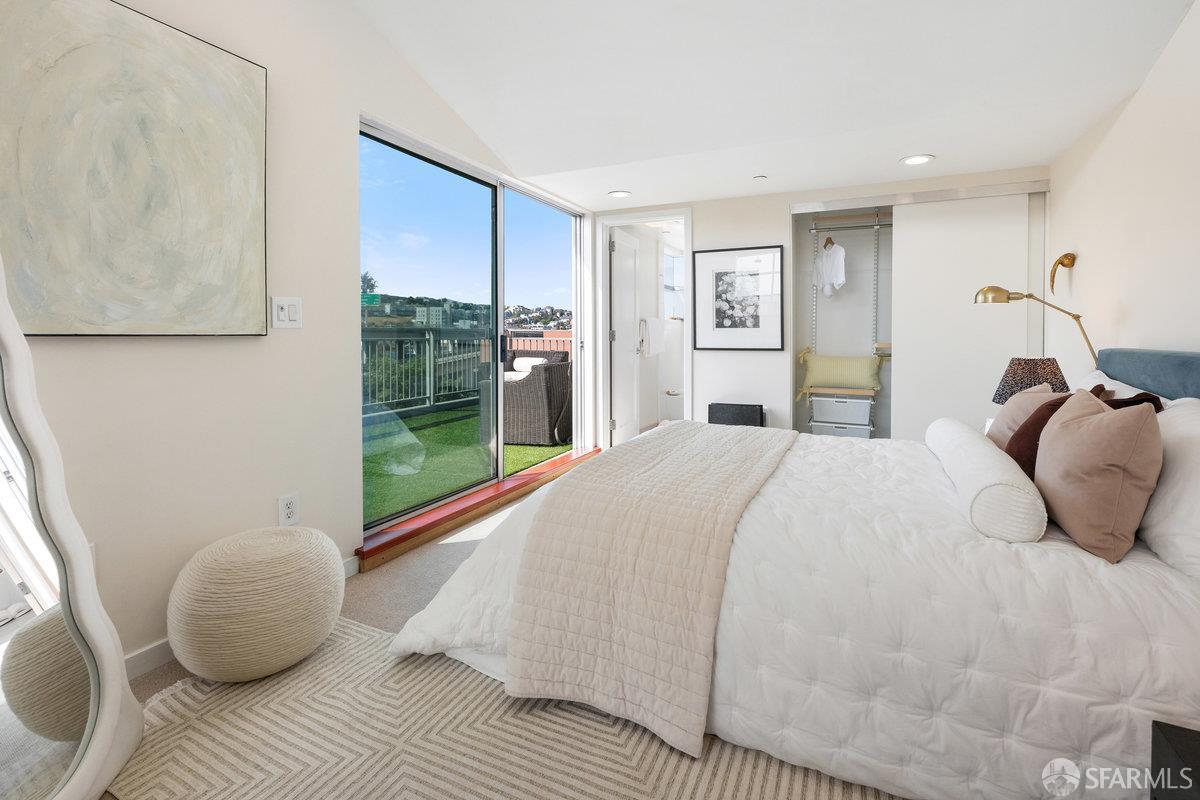1325 Indiana Street, Unit 301 San Francisco, CA 94107 - Photo 25 of 41 a bedroom with a bed and glass window