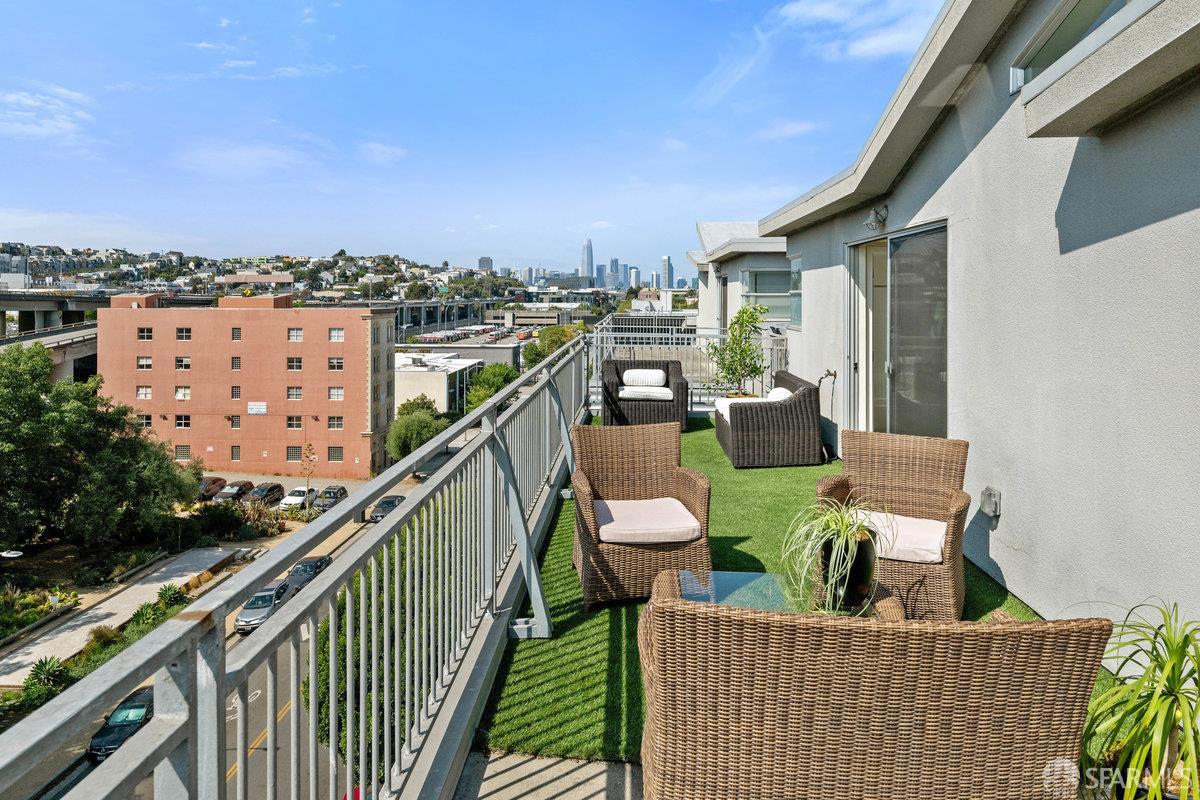 1325 Indiana Street, Unit 301 San Francisco, CA 94107 - Photo 29 of 41 a balcony with wooden floor and city view