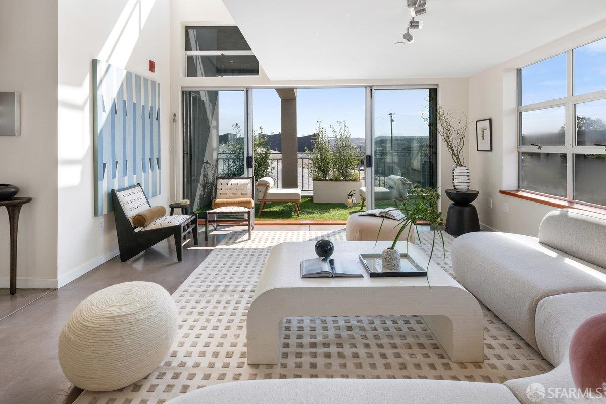 1325 Indiana Street, Unit 301 San Francisco, CA 94107 - Photo 4 of 41 a living room with furniture and a large window
