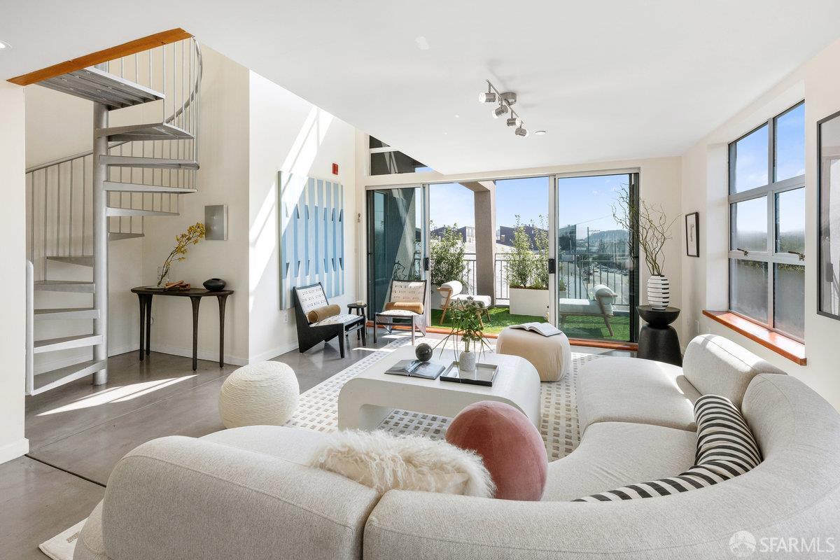 1325 Indiana Street, Unit 301 San Francisco, CA 94107 - Photo 7 of 41 a living room with furniture and a large window