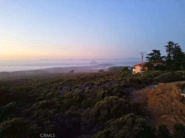 a view of a city of mountains in an ocean