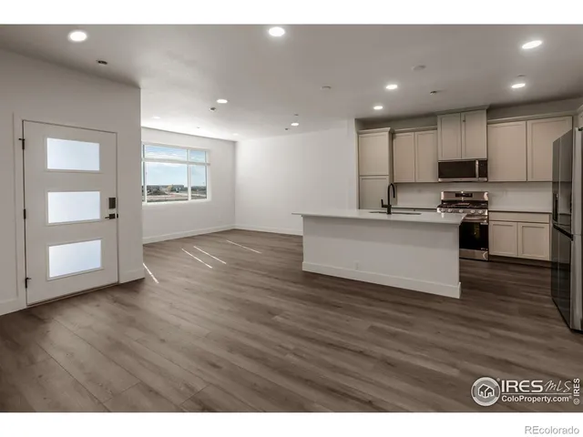 a view of kitchen with wooden floor