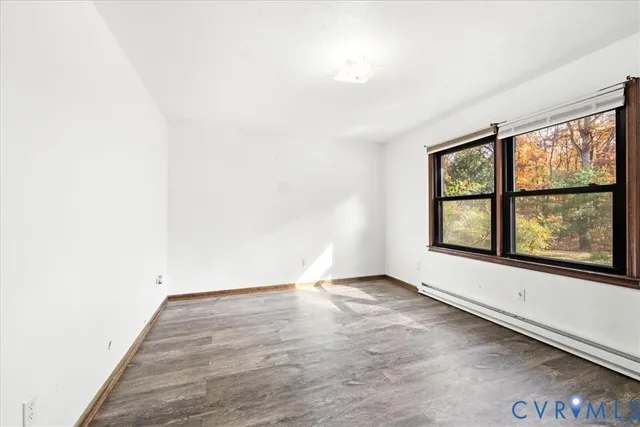 a kitchen with white cabinets and sink