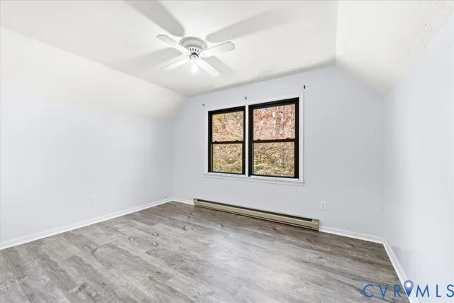 a bathroom with a granite countertop toilet a sink and a mirror
