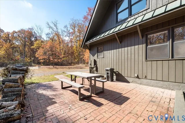 a view of backyard with a patio and outdoor seating