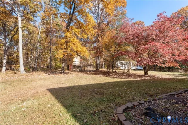 a view of a field with trees