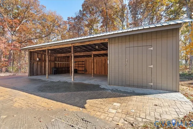a view of backyard with garage