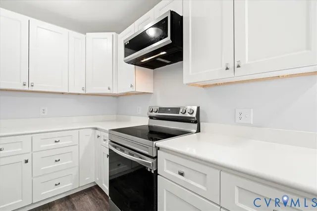 a spacious bathroom with a double vanity sink a mirror and a bathtub