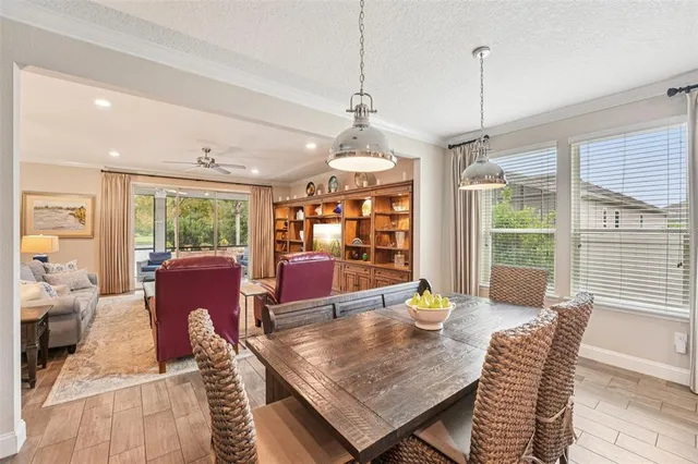 a kitchen with stainless steel appliances granite countertop white cabinets and a stove a oven with white countertops