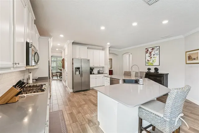 a living room with furniture and a large window with outer view