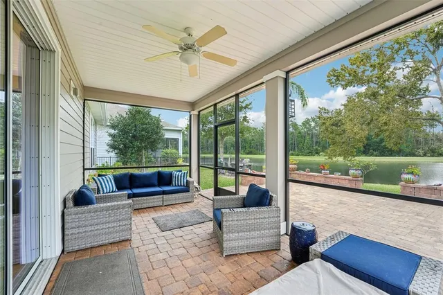 a en suite bathroom with a double vanity sink a mirror and a bathtub