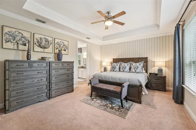 a blue couch sitting in a living room with a rug