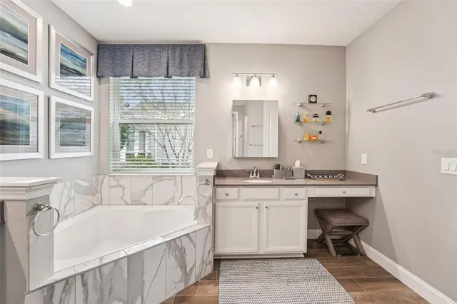 a bedroom with a bed and a television