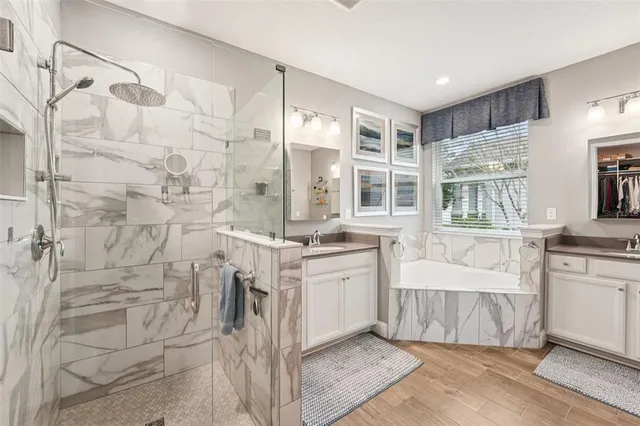 a bathroom with a double vanity sink and a mirror