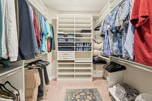 a bathroom with a granite countertop sink toilet a mirror and shower