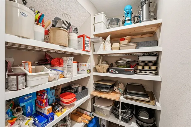 an aerial view of a house with pool lake view and mountain view