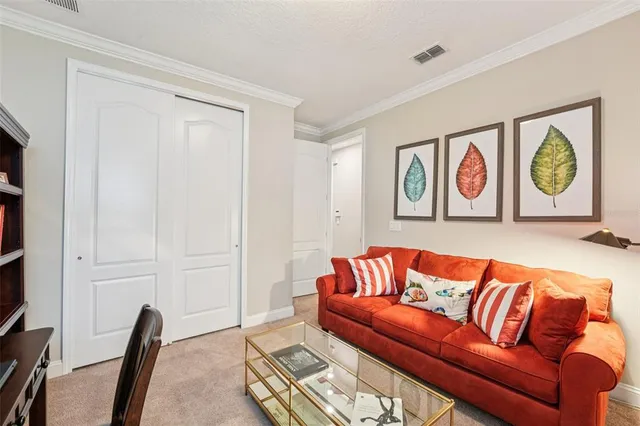 an aerial view of residential houses with outdoor space and street view