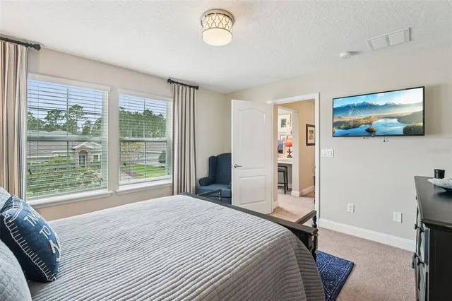 a view of a lake with houses in the back